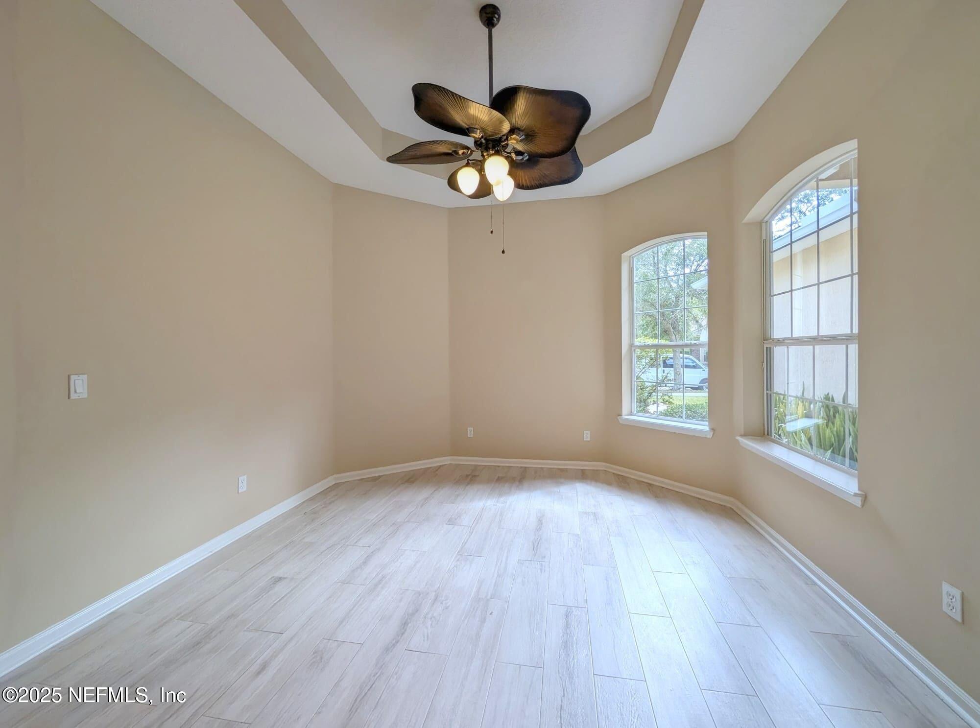 5871 Brush Hollow Road Jacksonville, FL 32258 - Photo 10 of 40 wooden floor in an empty room with a window