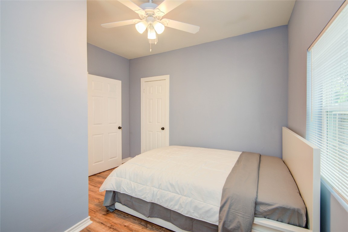 2712 Link Road Houston, TX 77009 - Photo 26 of 35 a bedroom with a bed and a chandelier