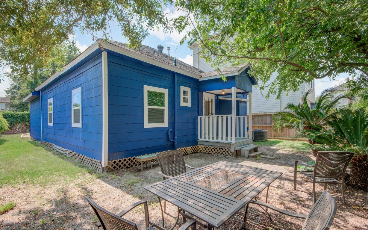 2712 Link Road Houston, TX 77009 - Photo 34 of 35 a view of backyard of house with wooden deck and furniture