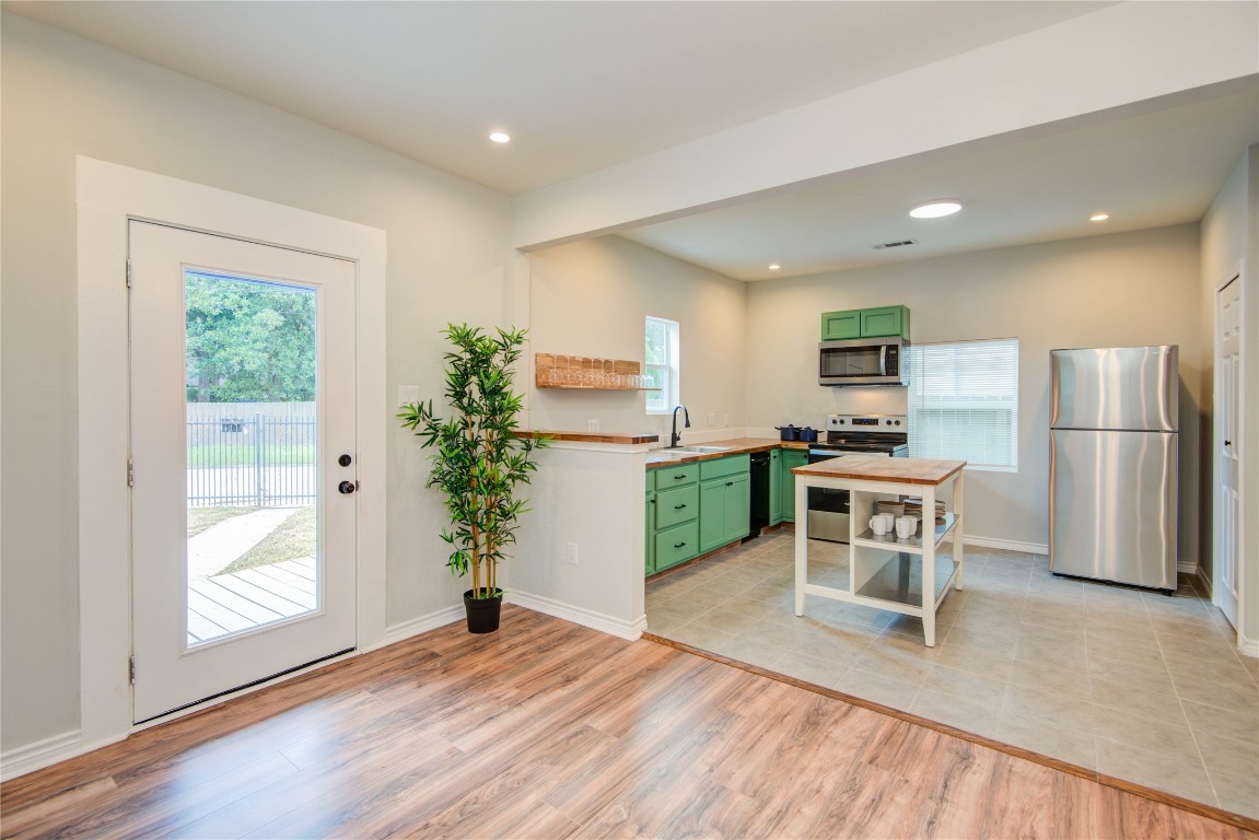 2712 Link Road Houston, TX 77009 - Photo 7 of 35 a kitchen with furniture and a refrigerator