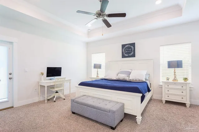 a bedroom with a bed and a chair