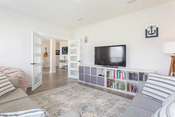 a livingroom with furniture and a flat screen tv