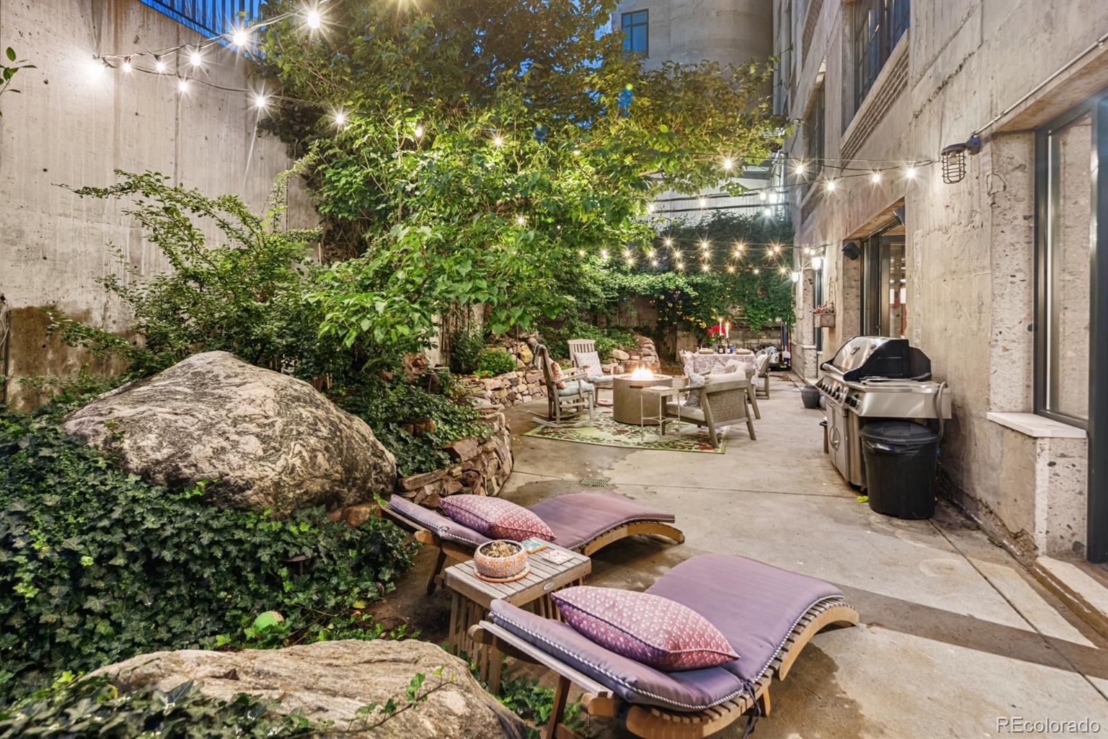2000 Little Raven Street, Unit 1B Denver, CO 80202 - Photo 32 of 39 a view of a patio with chairs and potted plants