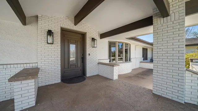 a view of hallway with livingroom and furniture