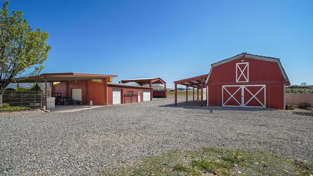 a view of a house with large trees