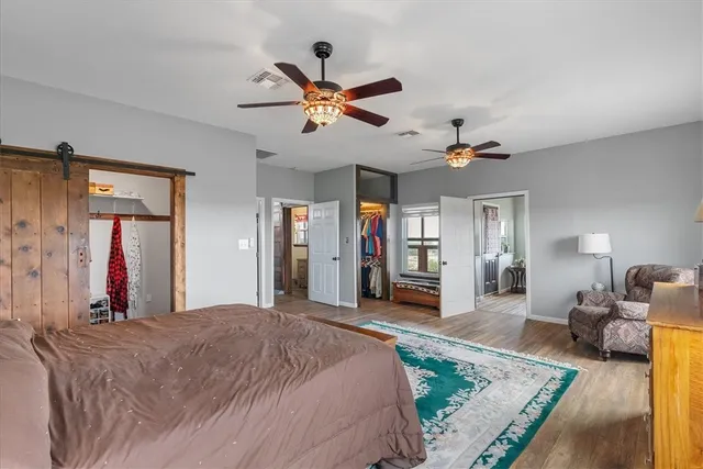 a bed room with a bed and a mirror