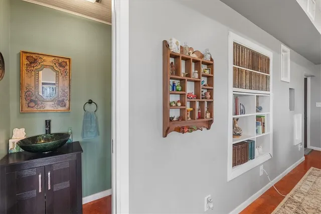 a room with a book shelf and a shelf
