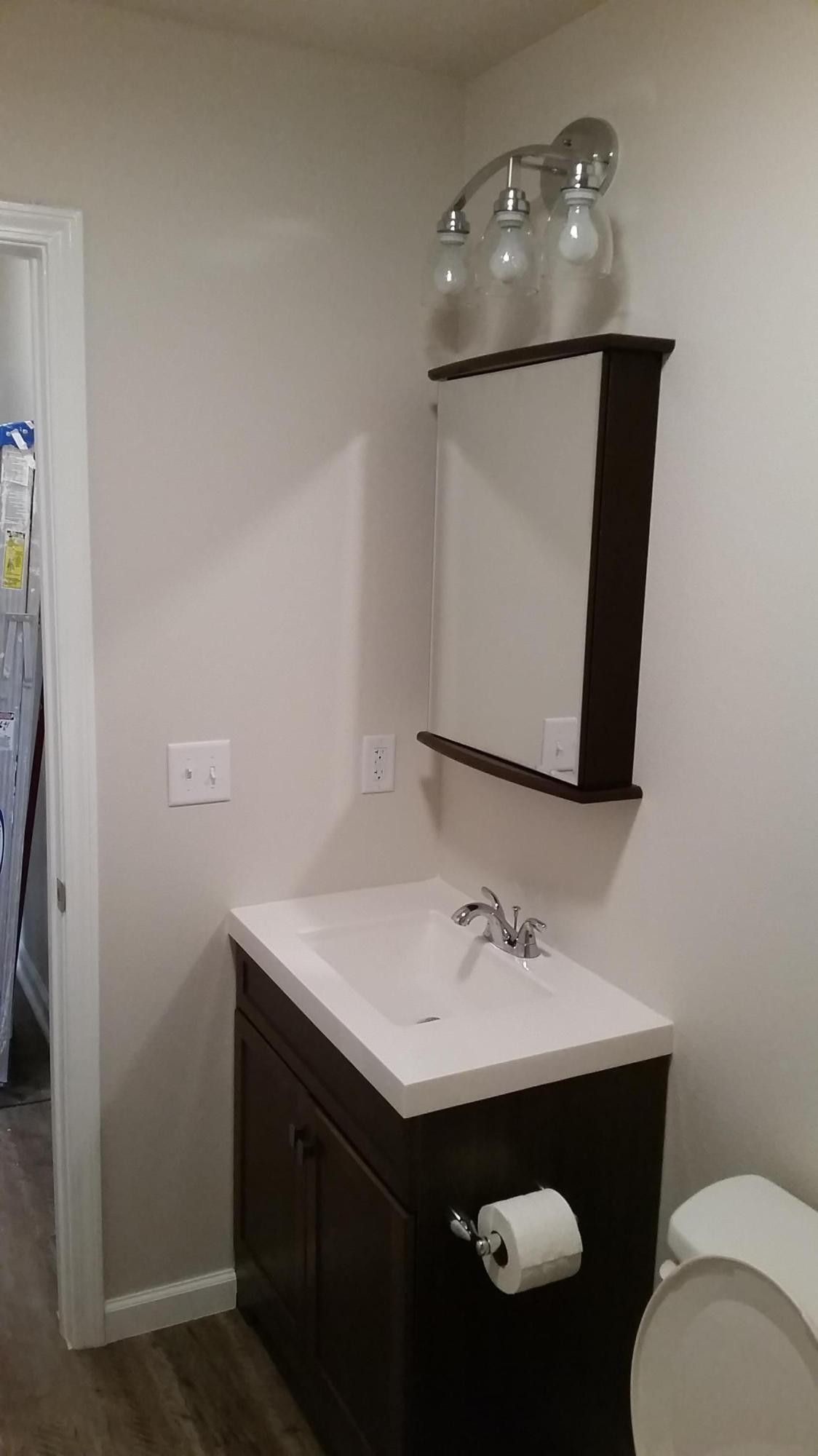 941 Valley Road, Unit C Crestview, FL 32539 - Photo 2 of 3 a bathroom with a sink vanity and toilet