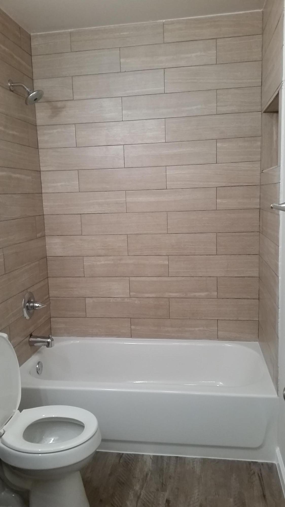 941 Valley Road, Unit C Crestview, FL 32539 - Photo 3 of 3 a bathroom with a toilet and a bathtub