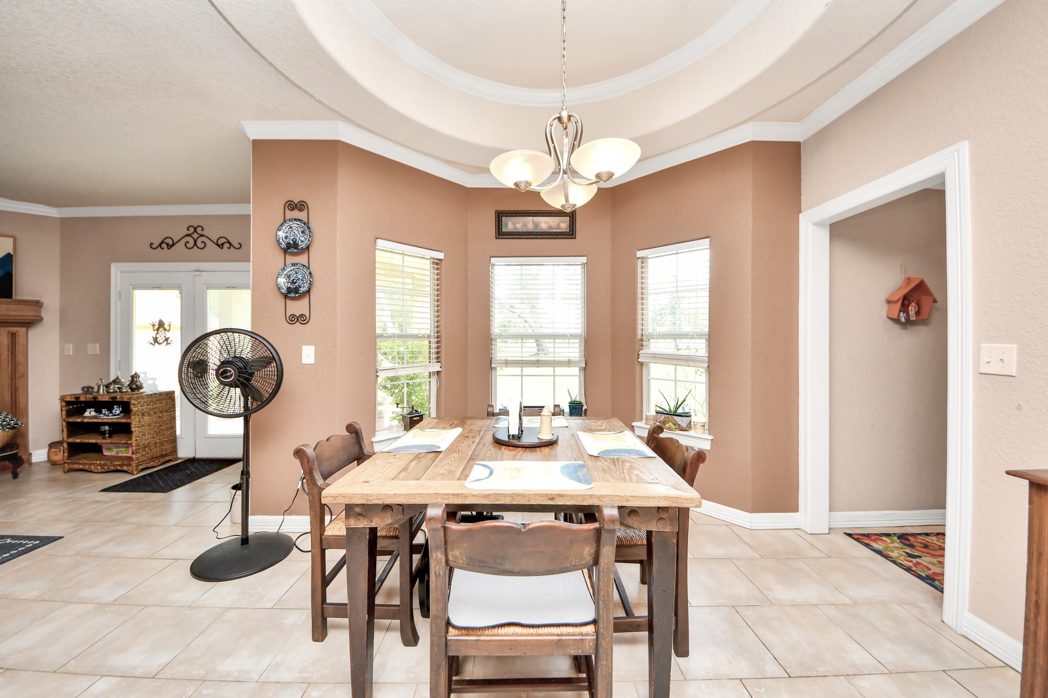1102 West Point Drive Rosharon, TX 77583 - Photo 15 of 39 Bright dining area with large windows and elegant crown molding.