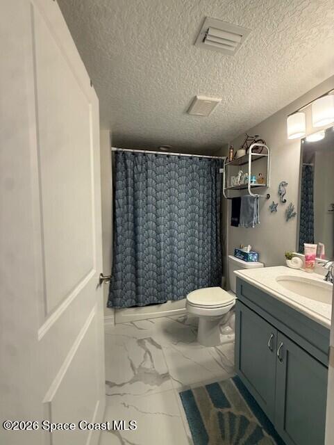 1805 Riverside Drive, Unit 404 Titusville, FL 32780 - Photo 17 of 19 a bathroom with a sink a toilet and shower