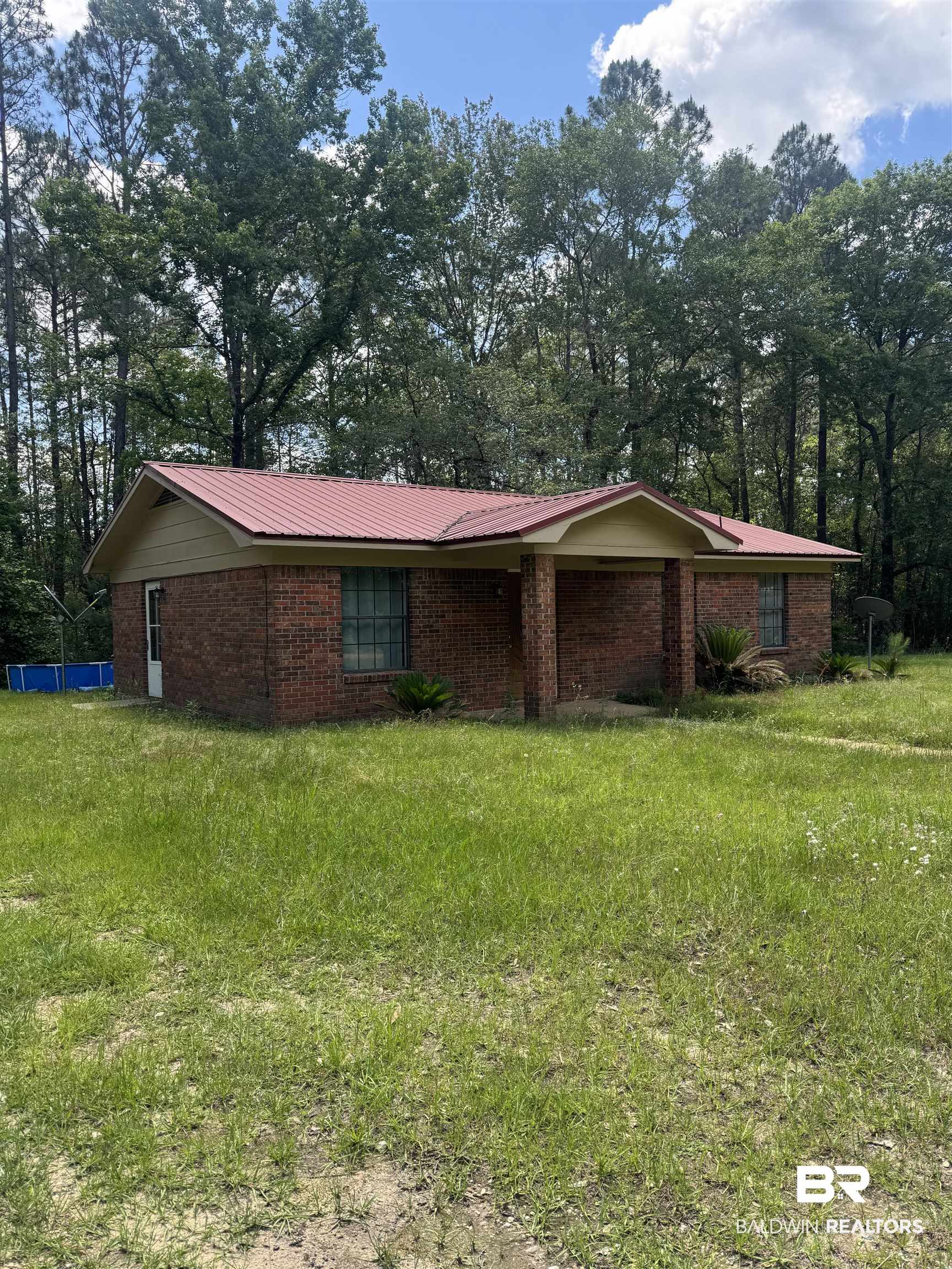 258 Johnson And Spotts Road Deer Park, AL 36529 - Photo 14 of 14 View of front of home featuring brick siding and metal roof