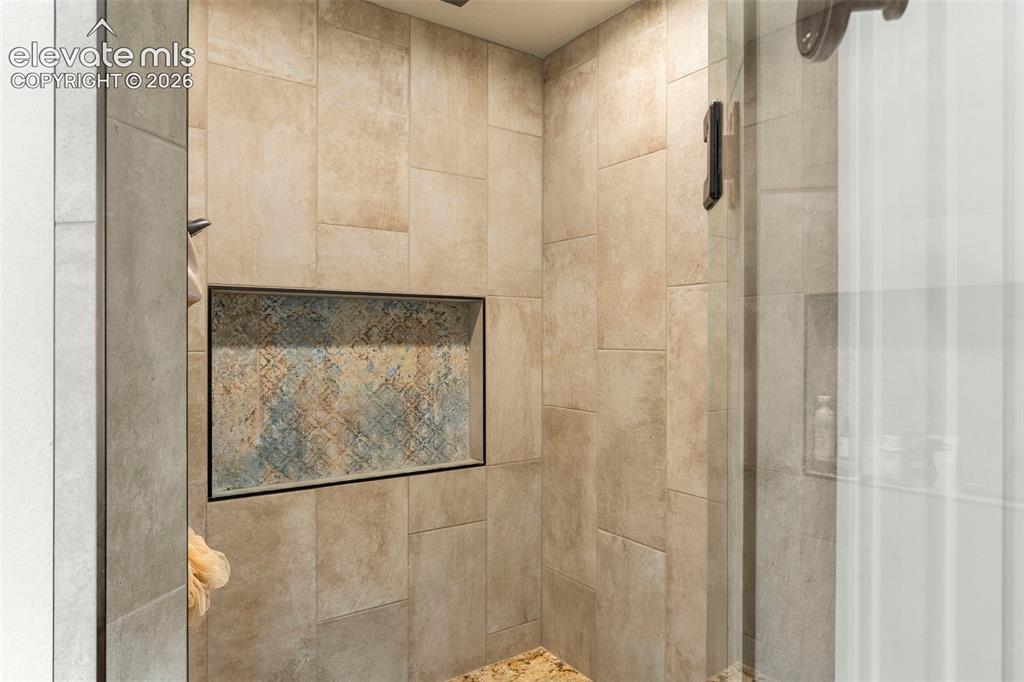 2480 North Log Road Calhan, CO 80808 - Photo 22 of 50 Tile shower with bench and glass door