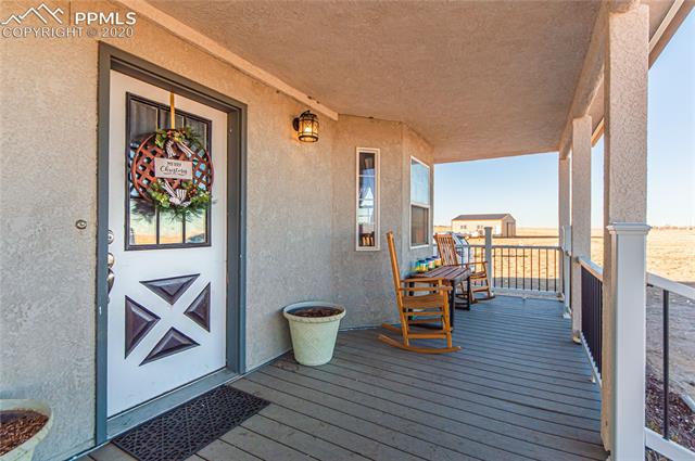 3250 North Rush Road Rush, CO 80833 - Photo 5 of 35 Front door with 30x30 barn in the background.