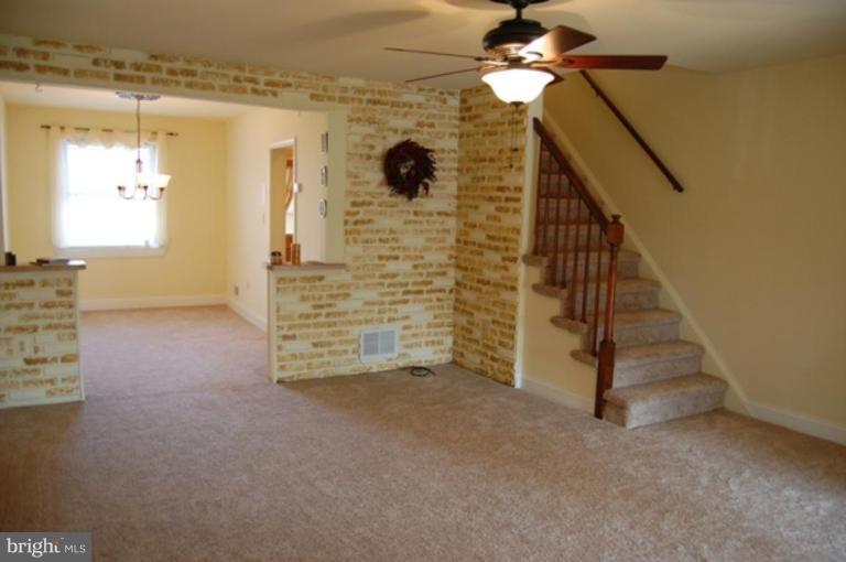 7942 Kavanagh Road Dundalk, MD 21222 - Photo 1 of 11 a view of an empty room with a fireplace