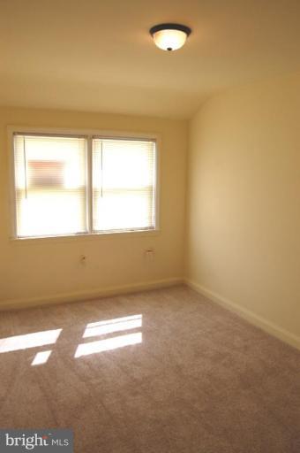 7942 Kavanagh Road Dundalk, MD 21222 - Photo 11 of 11 an empty room with a window