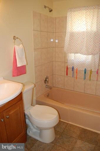 7942 Kavanagh Road Dundalk, MD 21222 - Photo 10 of 11 a bathroom with a toilet and a shower