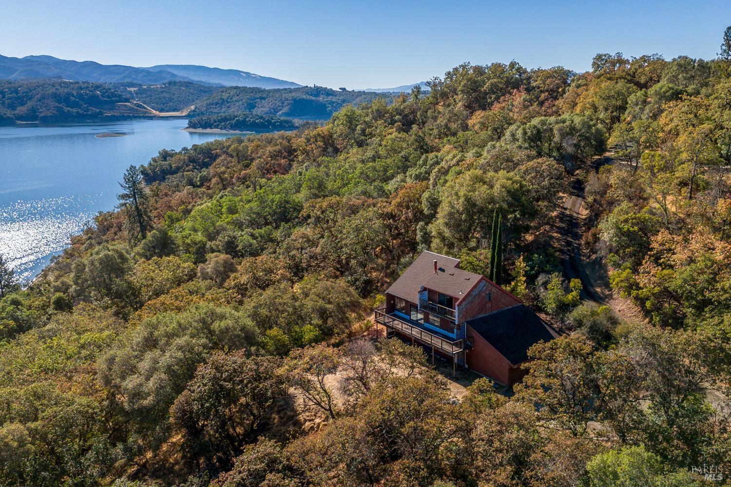 4500 Lake Ridge Road Ukiah, CA 95482 - Photo 1 of 1 a view of a house with a mountain yard