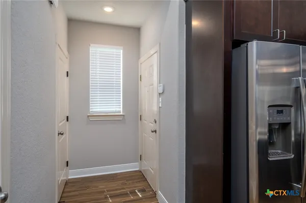 a kitchen with a sink and stainless steel appliances