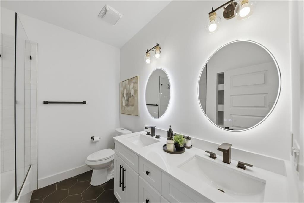 4107 Danforth Road Southwest Atlanta, GA 30331 - Photo 34 of 64 a bathroom with a double vanity sink and a mirror