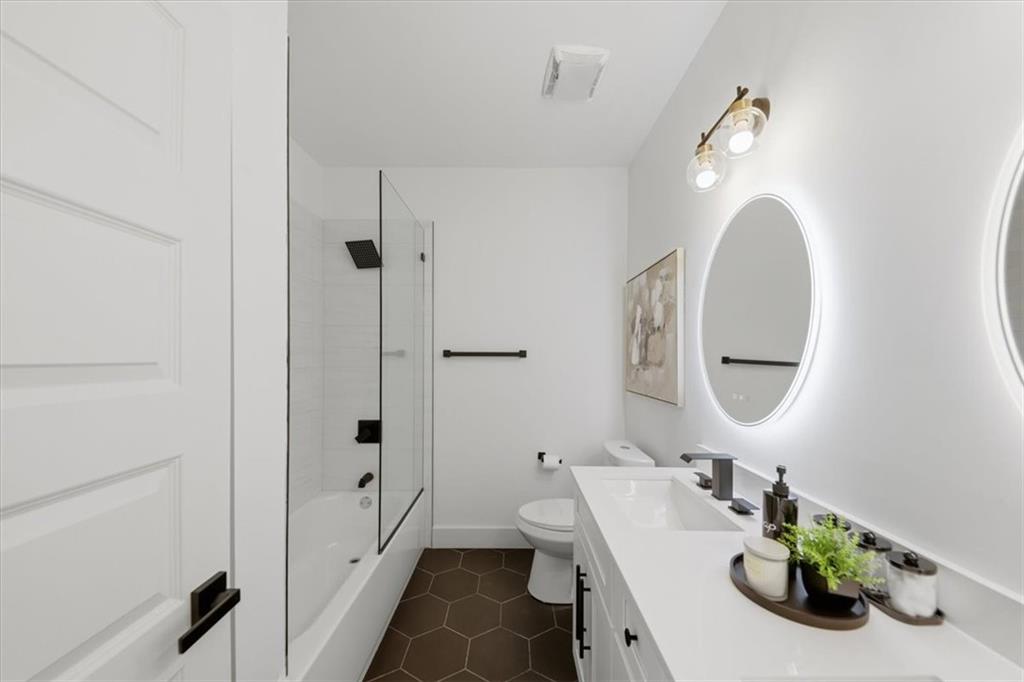 4107 Danforth Road Southwest Atlanta, GA 30331 - Photo 35 of 64 a bathroom with a sink a toilet and shower
