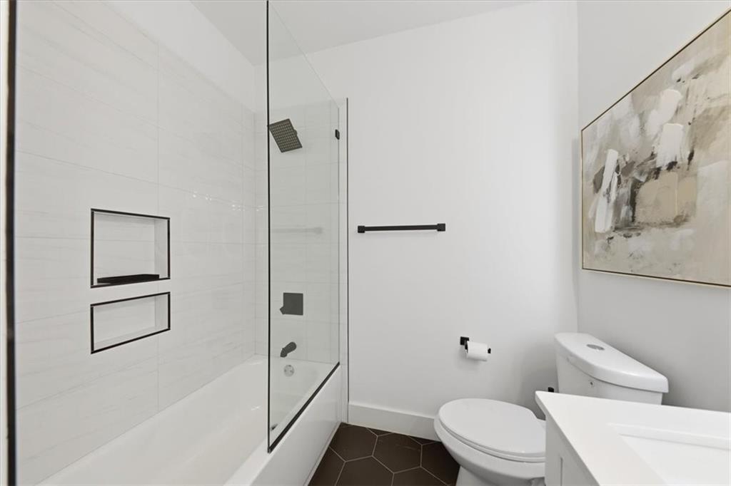 4107 Danforth Road Southwest Atlanta, GA 30331 - Photo 36 of 64 a bathroom with a toilet and a shower