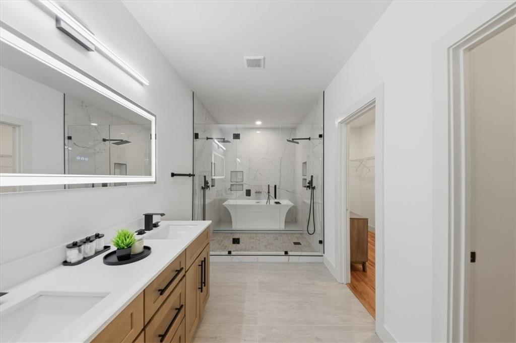 4107 Danforth Road Southwest Atlanta, GA 30331 - Photo 46 of 64 a bathroom with a sink mirror and a shower