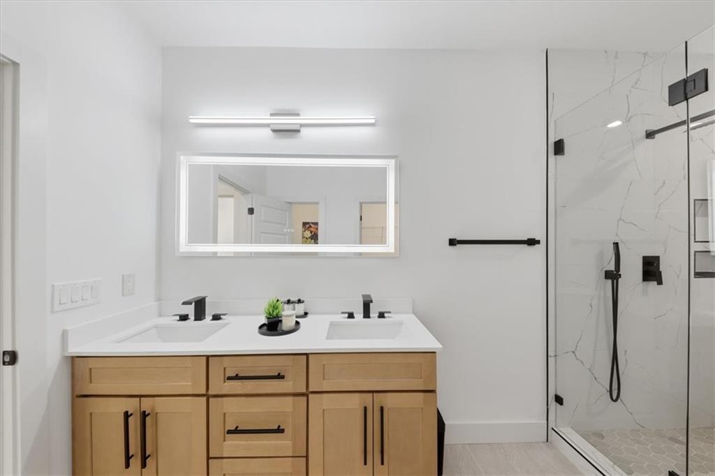 4107 Danforth Road Southwest Atlanta, GA 30331 - Photo 47 of 64 a bathroom with a sink vanity and a mirror