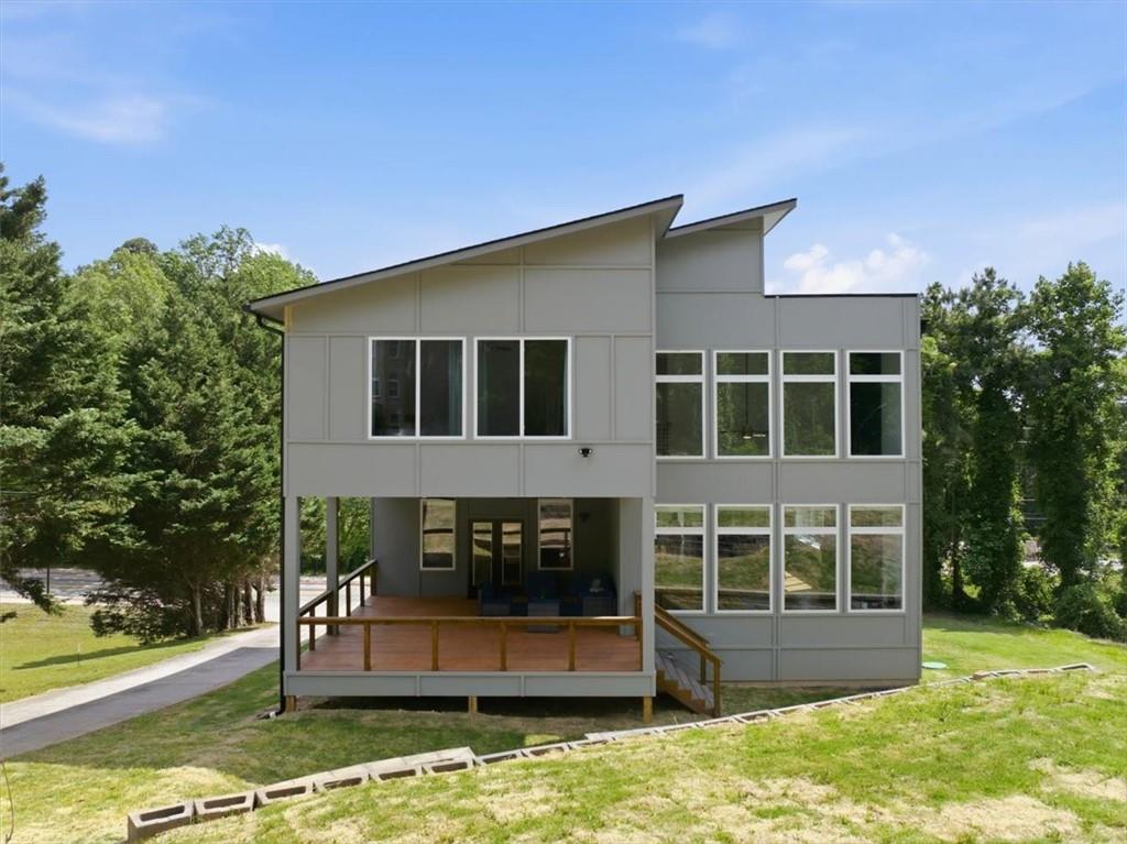 4107 Danforth Road Southwest Atlanta, GA 30331 - Photo 55 of 64 a house view with swimming pool in front of it