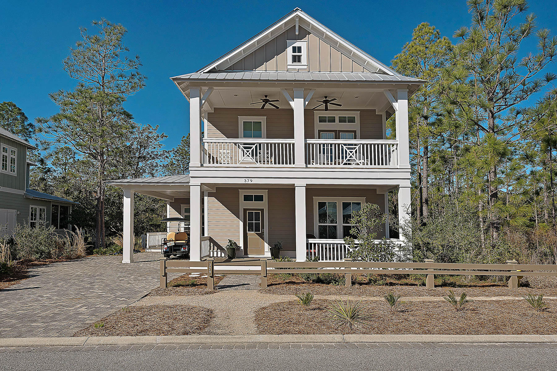 379 East Royal Fern Way Santa Rosa Beach, FL 32459 - Photo 1 of 53 a front view of a house with a yard and garage