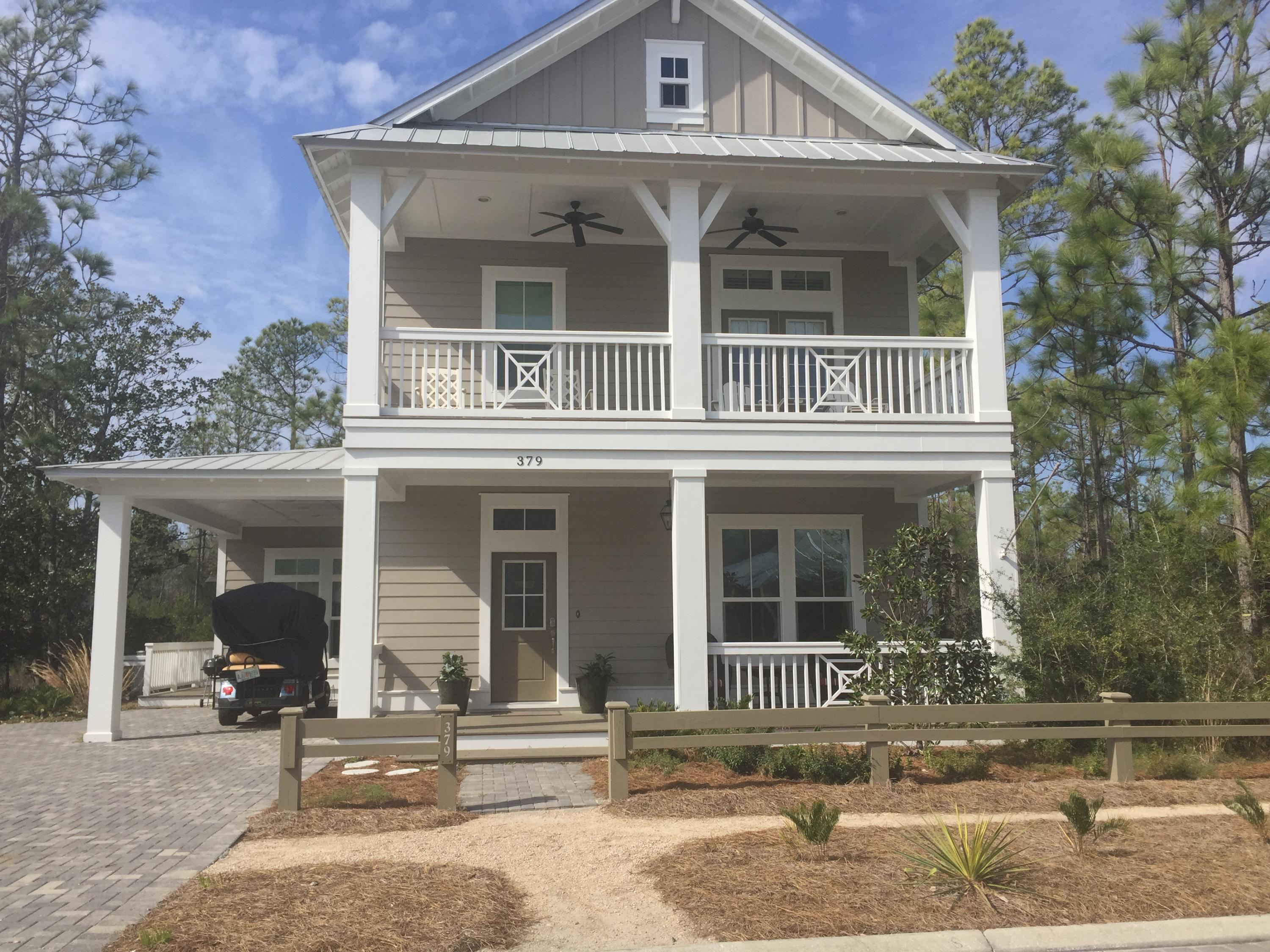 379 East Royal Fern Way Santa Rosa Beach, FL 32459 - Photo 2 of 53 a front view of a house with a porch