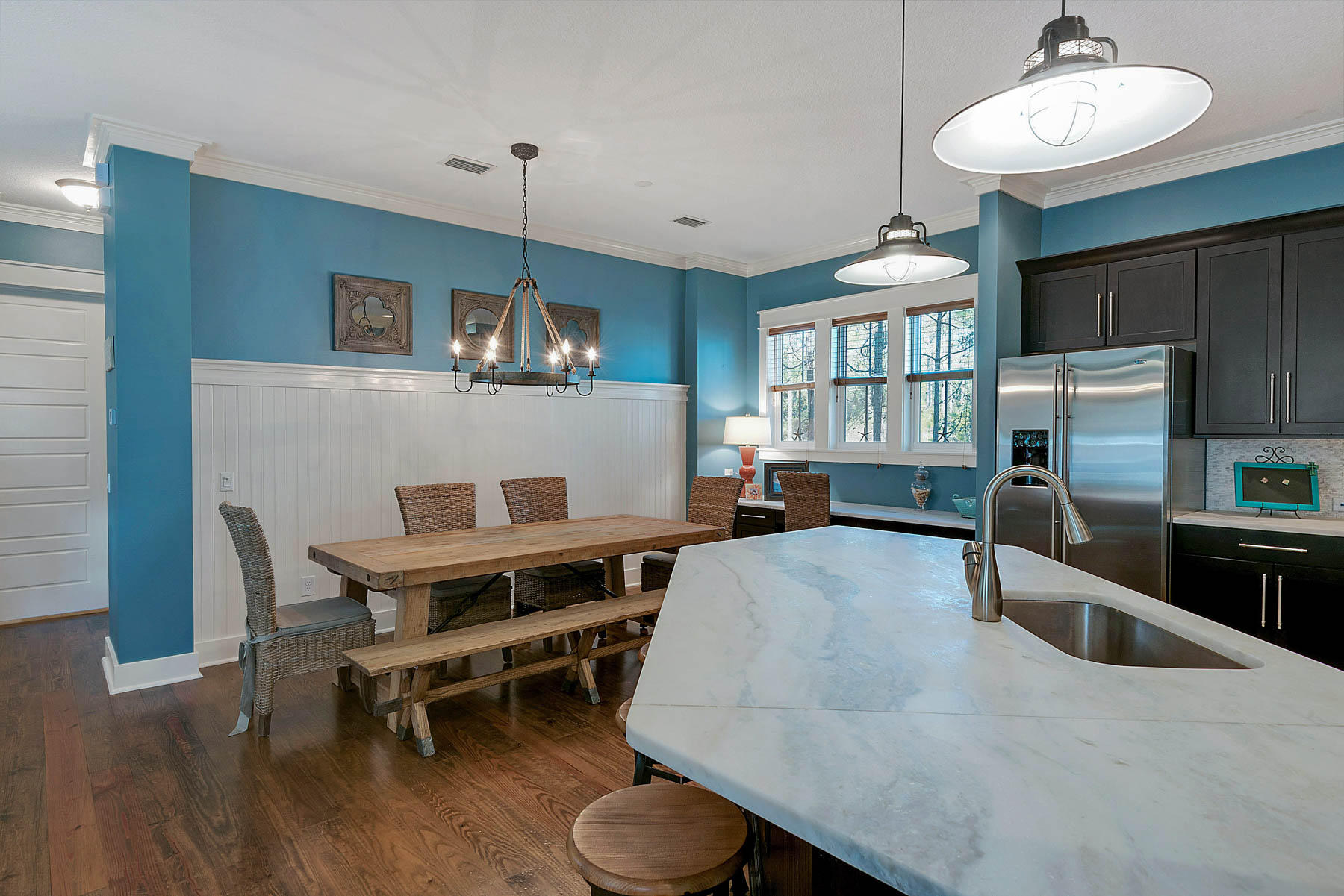 379 East Royal Fern Way Santa Rosa Beach, FL 32459 - Photo 13 of 53 a living room with furniture a dining table wooden floor and a chandelier