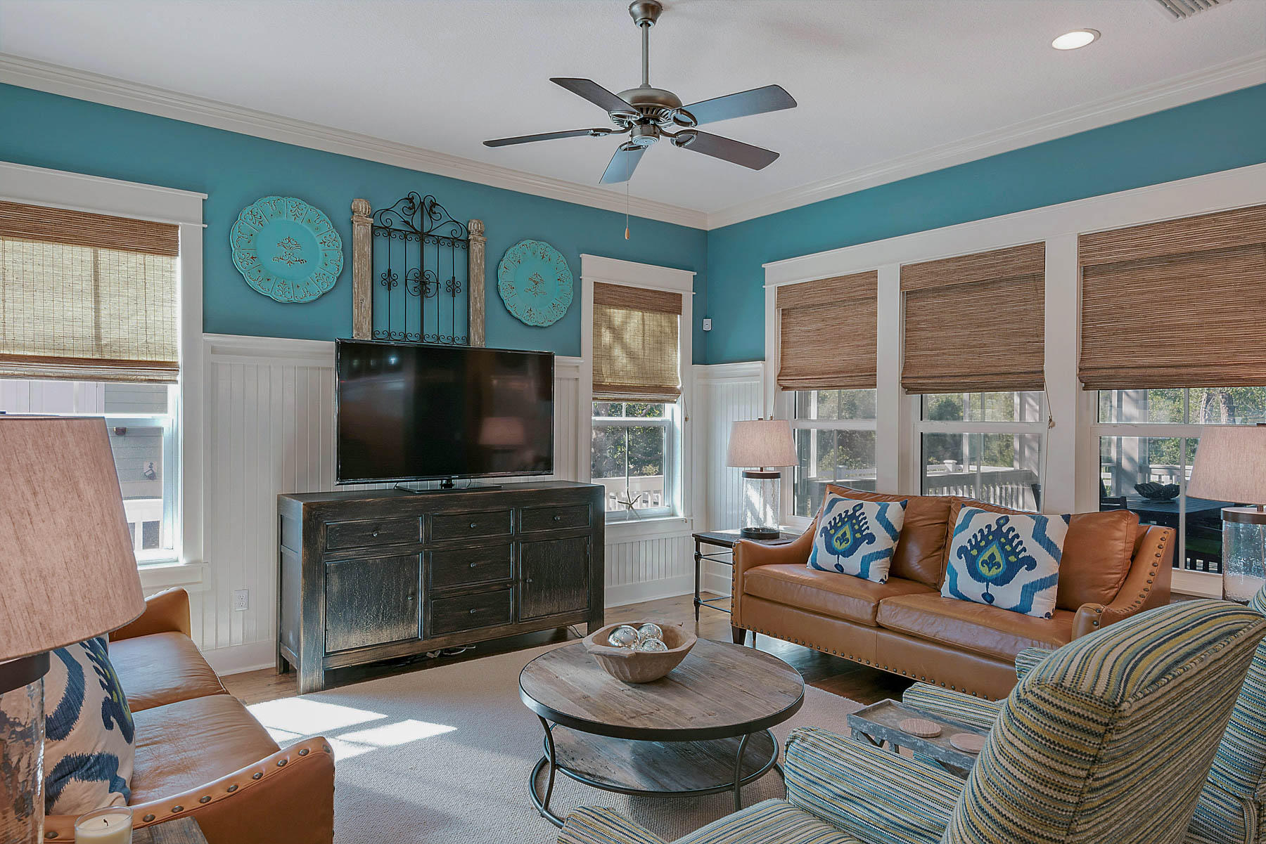 379 East Royal Fern Way Santa Rosa Beach, FL 32459 - Photo 14 of 53 a living room with furniture a flat screen tv and a large window