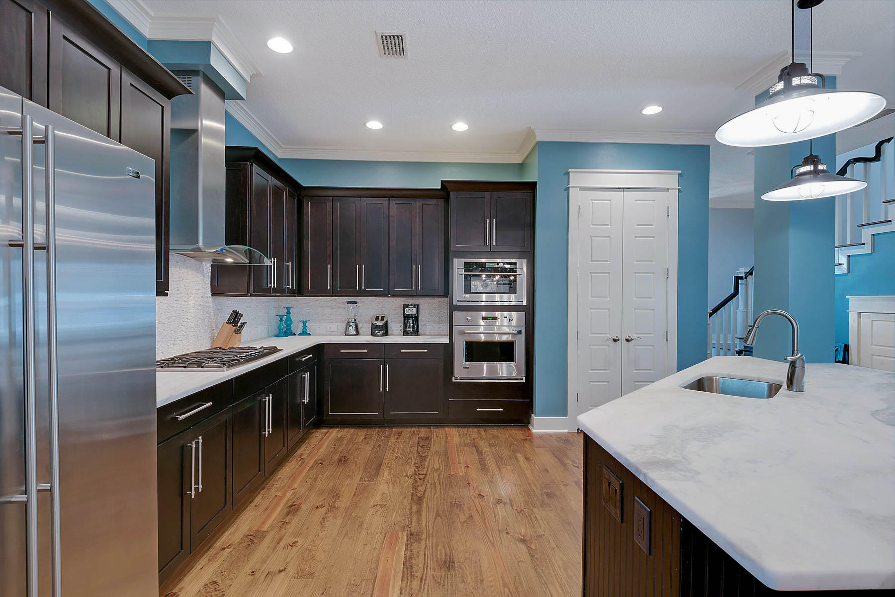 379 East Royal Fern Way Santa Rosa Beach, FL 32459 - Photo 22 of 53 a kitchen with stainless steel appliances kitchen island granite countertop a sink refrigerator and cabinets