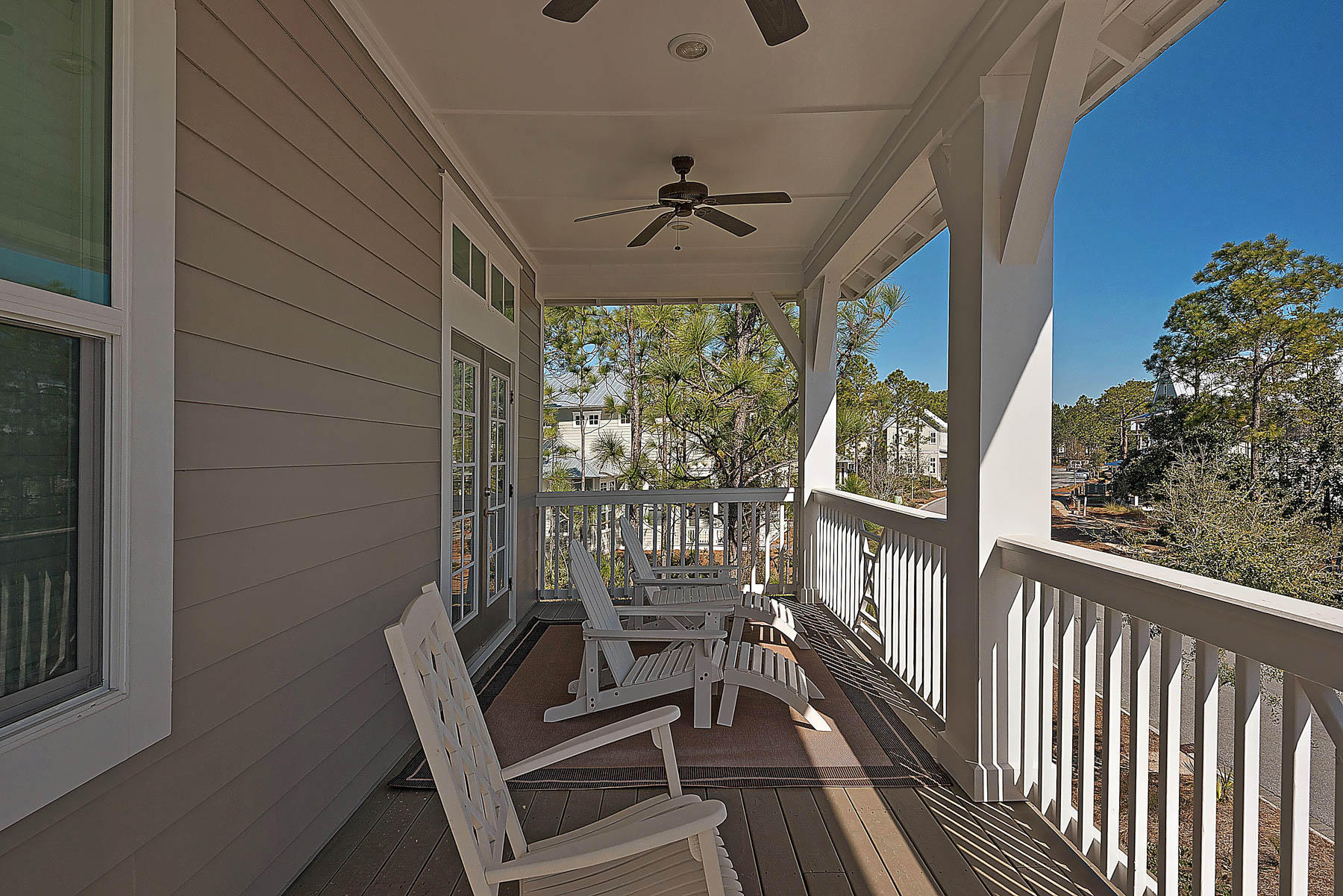 379 East Royal Fern Way Santa Rosa Beach, FL 32459 - Photo 39 of 53 a view of a porch with furniture and wooden deck