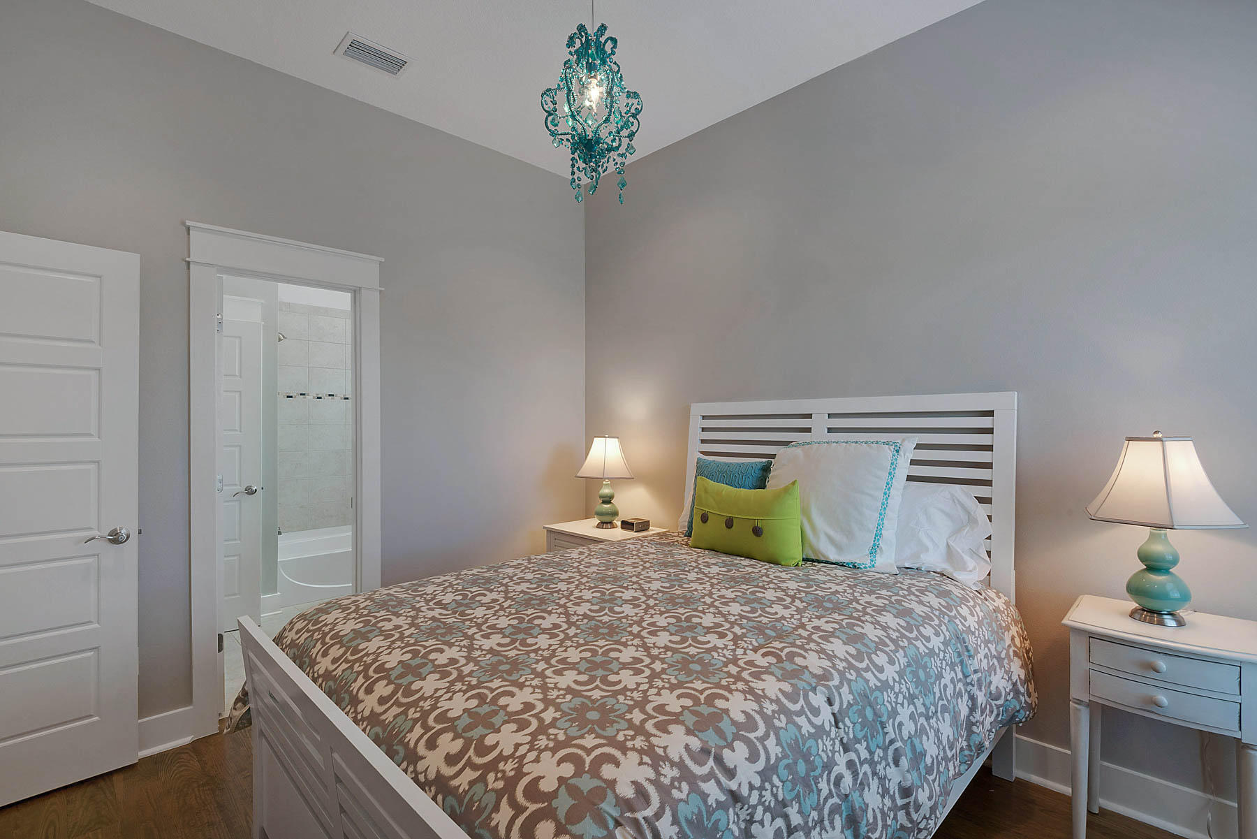 379 East Royal Fern Way Santa Rosa Beach, FL 32459 - Photo 42 of 53 a bedroom with a bed and a chandelier