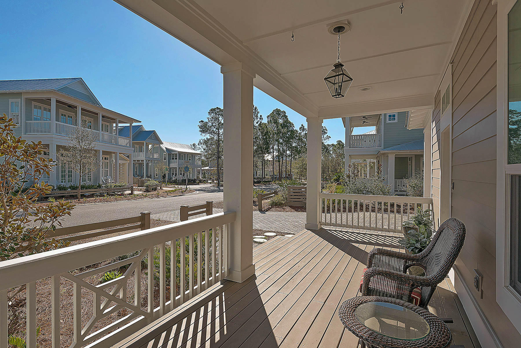 379 East Royal Fern Way Santa Rosa Beach, FL 32459 - Photo 6 of 53 a view of a chair and tables in the balcony