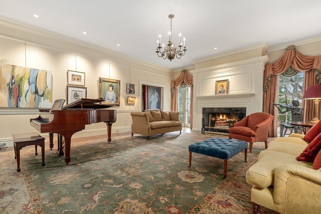 14 Old Orchard Road Newton, MA 02467 - Photo 11 of 34 a living room with furniture a fireplace and a chandelier