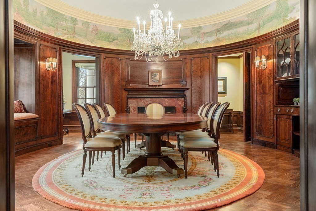 14 Old Orchard Road Newton, MA 02467 - Photo 12 of 34 a dining room with furniture a chandelier and wooden floor