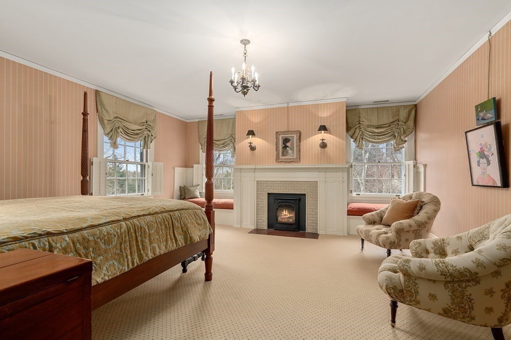 14 Old Orchard Road Newton, MA 02467 - Photo 20 of 34 a spacious bedroom with a bed and a fireplace