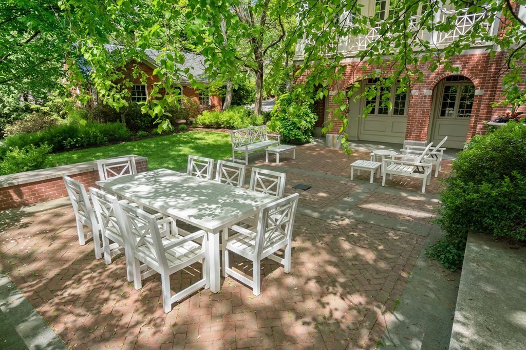 14 Old Orchard Road Newton, MA 02467 - Photo 27 of 34 a view of a patio with table and chairs and potted plants with large tree