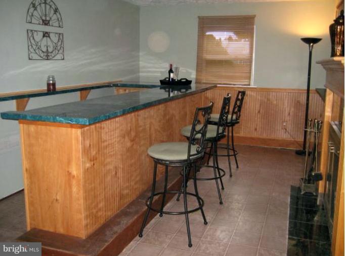 9660 Dundawan Road Nottingham, MD 21236 - Photo 2 of 20 Full Size Bar w/fireplace