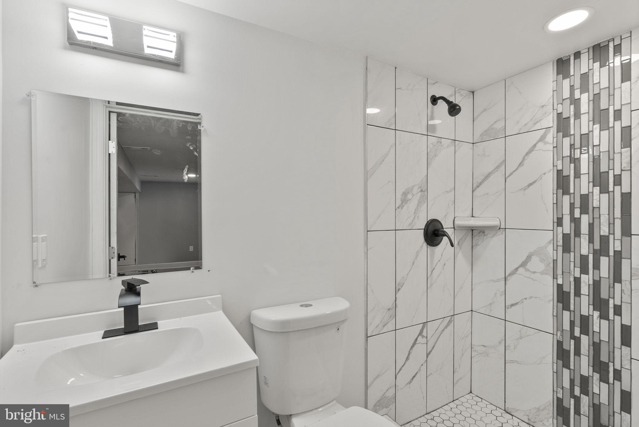 3417 Springdale Avenue Baltimore, MD 21216 - Photo 24 of 60 a bathroom with a sink toilet and shower