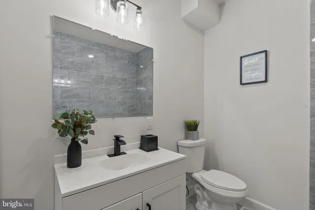 a view of hallway with furniture and a large window