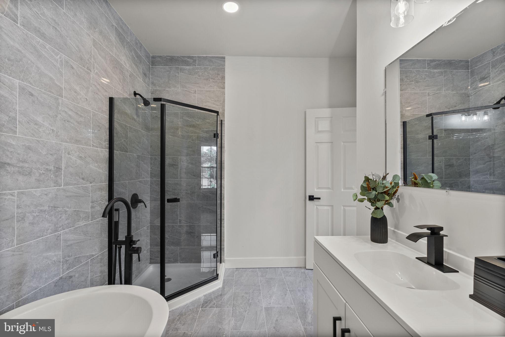 3417 Springdale Avenue Baltimore, MD 21216 - Photo 39 of 60 a bathroom with a sink toilet and shower