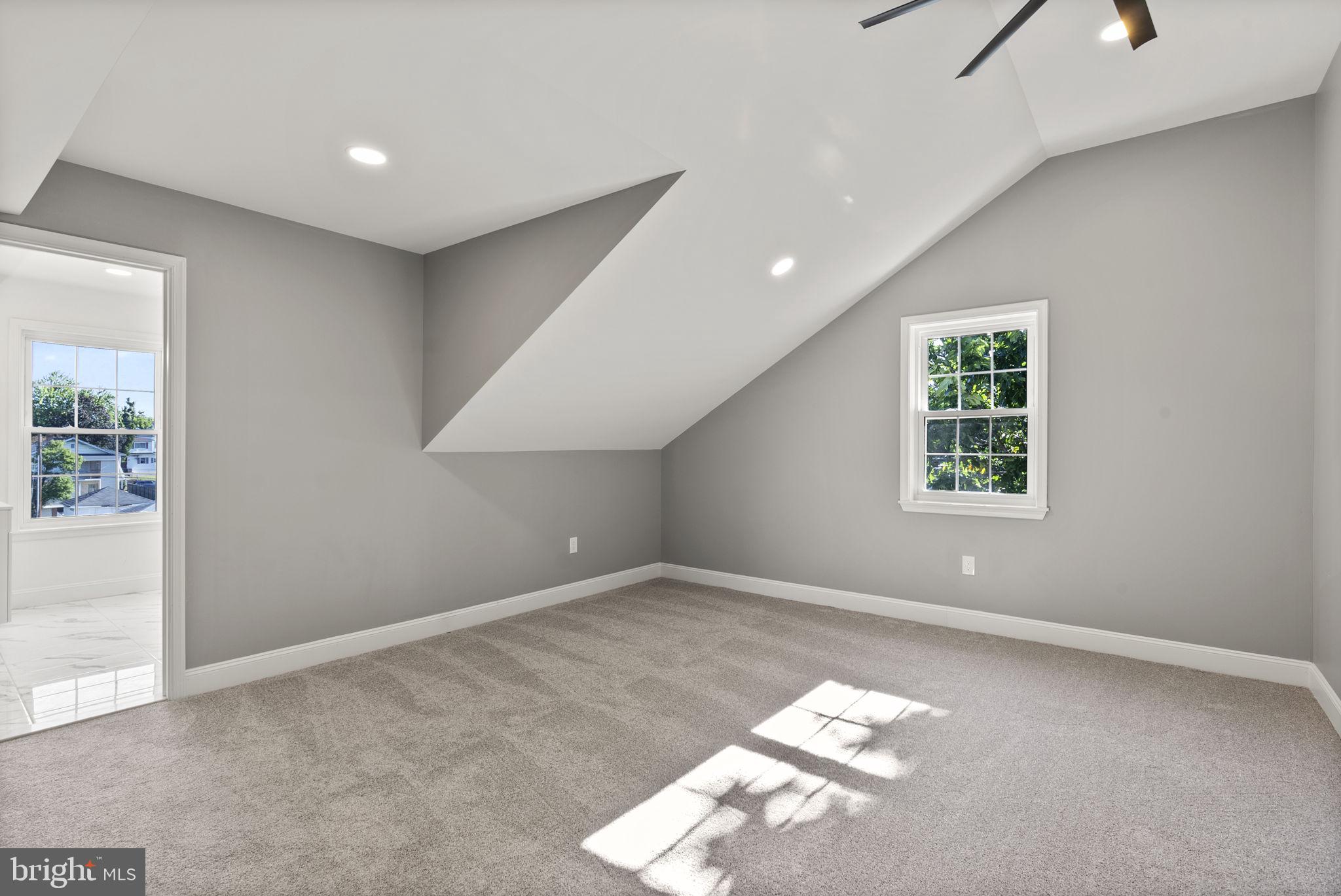 3417 Springdale Avenue Baltimore, MD 21216 - Photo 44 of 60 an empty room with windows