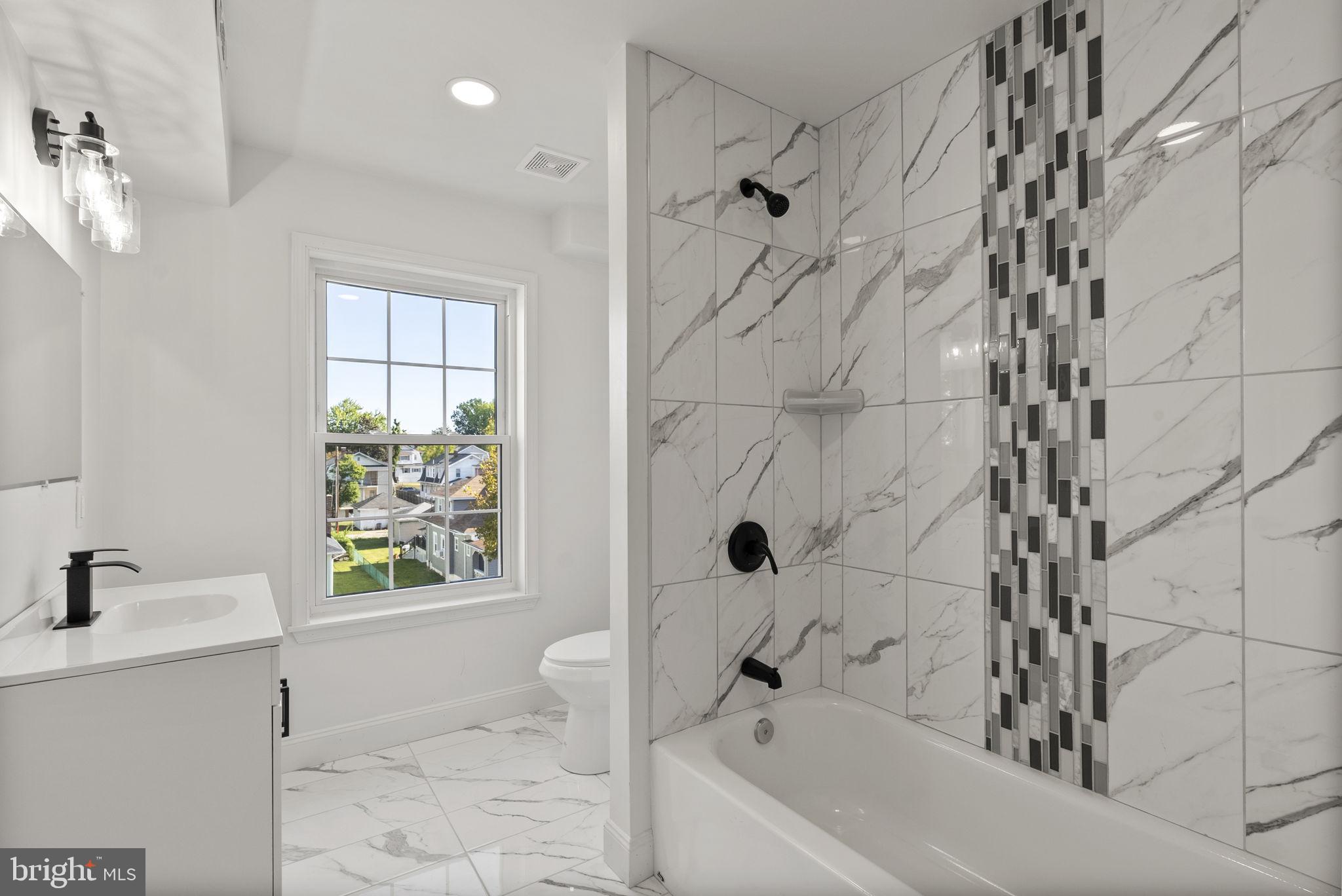 3417 Springdale Avenue Baltimore, MD 21216 - Photo 46 of 60 a bathroom with a bathtub sink and toilet