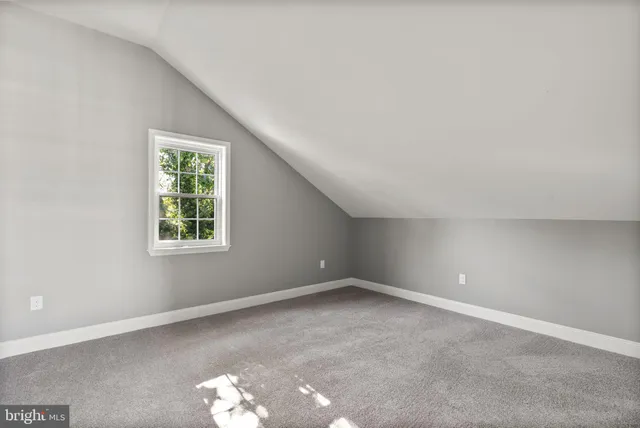 a view of backyard with deck and garden