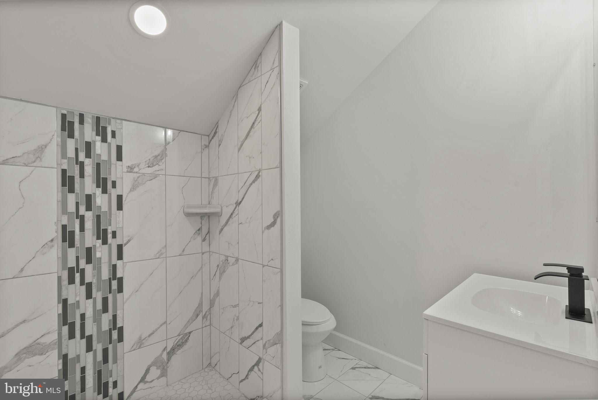 3417 Springdale Avenue Baltimore, MD 21216 - Photo 53 of 60 a bathroom with a sink toilet and shower