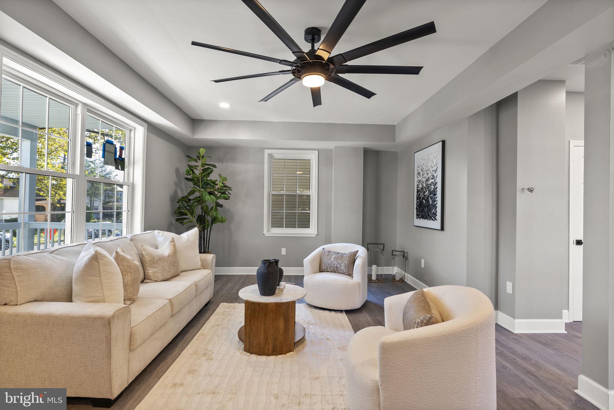 3417 Springdale Avenue Baltimore, MD 21216 - Photo 6 of 60 a living room with furniture and a large window